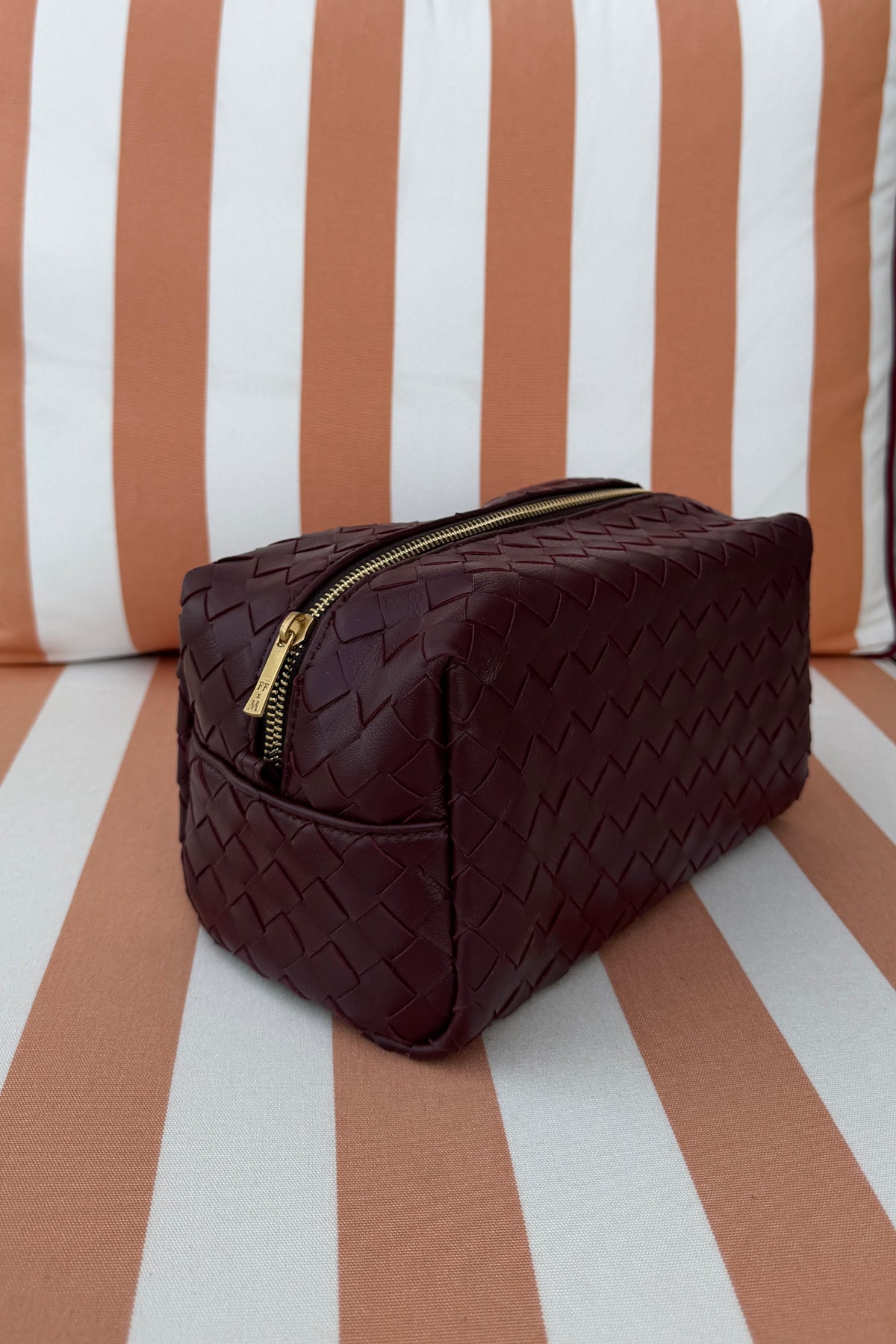 burgundy leather pouch Estelle Finefurs x media label with gold zips make up bag travel essentials